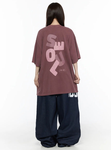 Oversized Seoul Graphic T-Shirt IL516 Dark red back full-body shot on female model showing large pink SEOUL typography graphic with 서울 stamp print