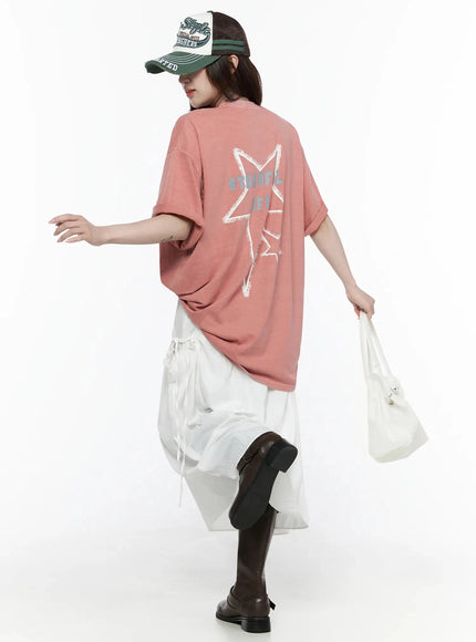 LEWKIN Oversized Star Graphic T-Shirt IL516 Pink back view on female model walking in street style outfit with white skirt and dark boots