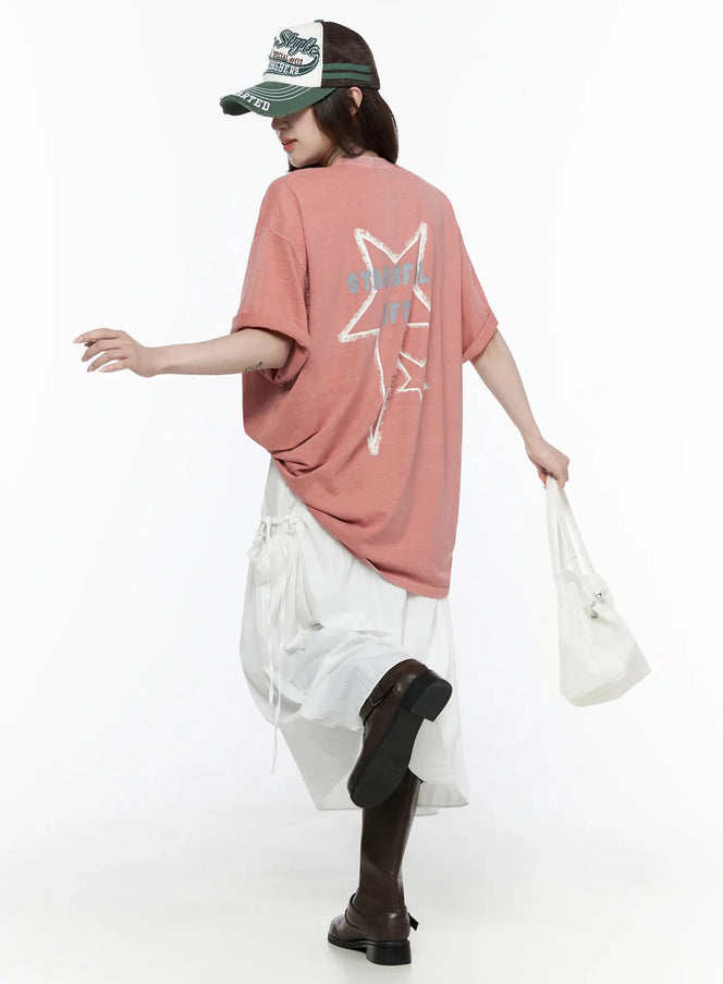 LEWKIN Oversized Star Graphic T-Shirt IL516 Pink back view on female model walking in street style outfit with white skirt and dark boots