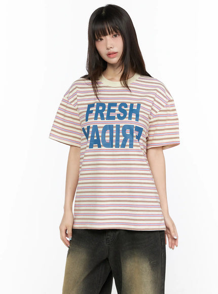 Oversized Striped Graphic Tee CL523 light beige front model half-body shot facing forward showing full graphic print crew neck and short sleeve detail