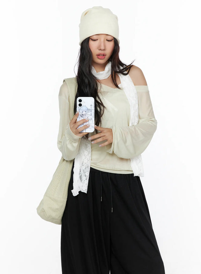 LEWKIN Oversized Summer Sheer V-Neck Long Sleeve Top CL513 Beige S/M front model shot looking down holding phone styled with lace scarf beanie and tote bag