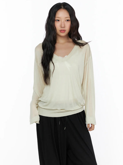 Oversized Summer Sheer V-Neck Long Sleeve Top CL513 Beige front close-up model upper body showing V-neck lace trim detail sheer lightweight fabric texture