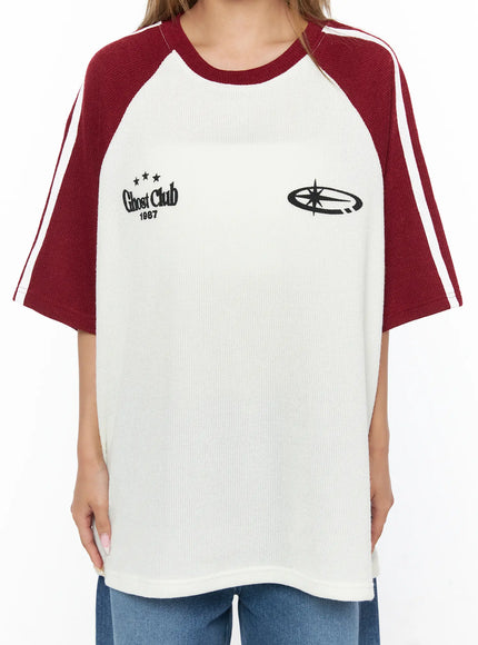 Oversized Waffle Knit Tee CU523 Dark red close-up front detail shot on model showing Ghost Club 1987 embroidery, star graphic, ribbed waffle knit texture and crew neckline