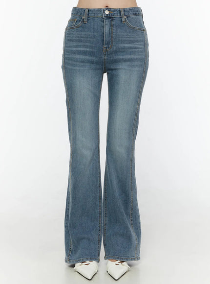 LEWKIN Paget Flared Bootcut Jeans IL506 Blue front view on model cropped at waist showing high-rise button closure and flared hem with white heels
