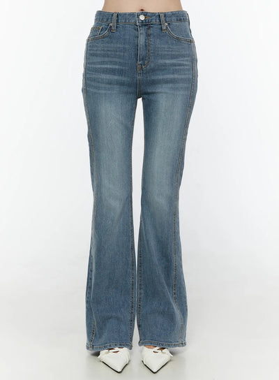 LEWKIN Paget Flared Bootcut Jeans IL506 Blue front view on model cropped at waist showing high-rise button closure and flared hem with white heels