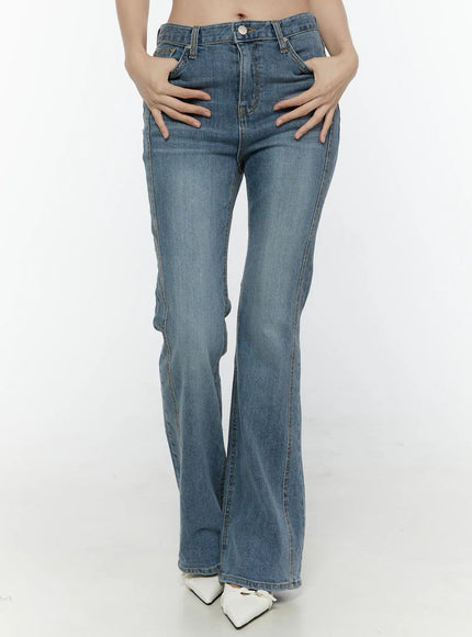 Paget Flared Bootcut Jeans IL506 Blue front view on model with hands on hips highlighting high-rise waist fitted thighs and flared bootcut leg