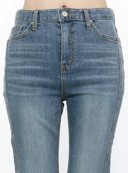 Paget Flared Bootcut Jeans IL506 Blue close-up front waistband detail showing button closure front pockets amber topstitching and faded denim texture