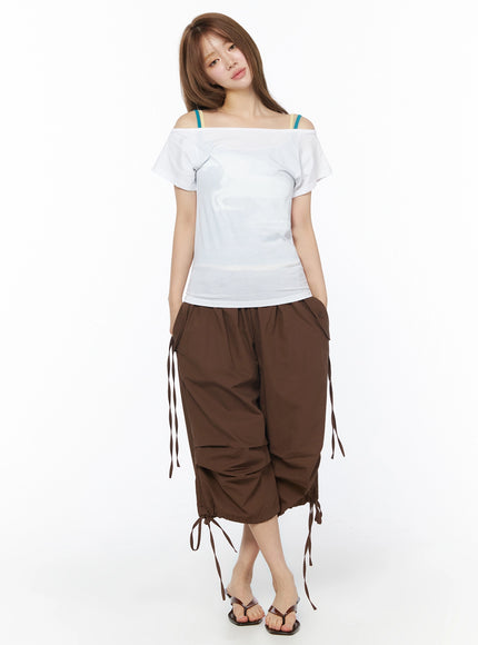 Parachute Cargo Shorts IU525 Brown full-body front on model styled with white off-shoulder top, teal bra straps, and brown thong heels