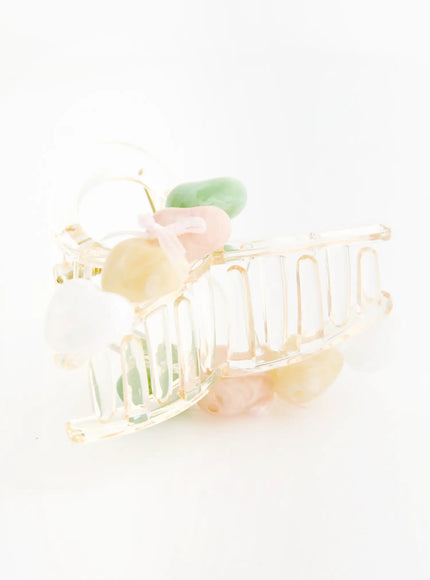 Pearl Green Hair Clip IL503 clear transparent claw clip side view revealing comb teeth structure with pastel green pink yellow heart stone embellishments