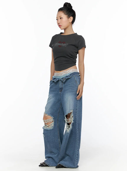 Pigment Cap Sleeve Tee CL510 Dark gray side model shot styled with ripped wide-leg denim and lace waistband visible cropped length and raglan sleeve seam detail