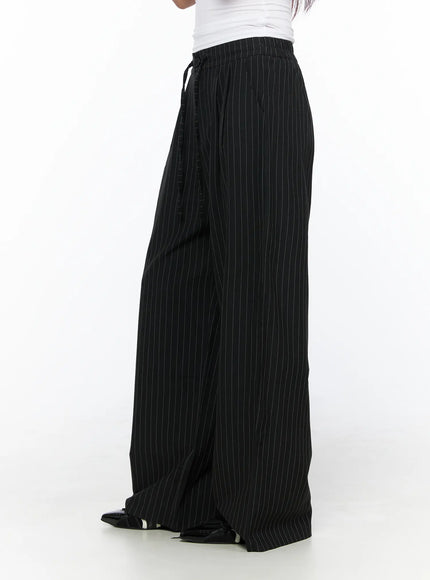Pinstripe Wide Leg Trousers CL513 Black side shot on model showing drawstring waistband and voluminous wide-leg drape with patent loafers