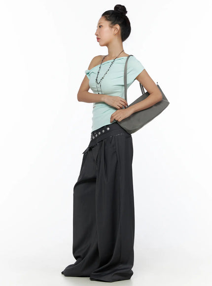 Pintuck Belted Wide Slacks CL510 dark gray side shot on model standing, wide-leg drape, crossover stud belt at low waist, styled with mint one-shoulder top