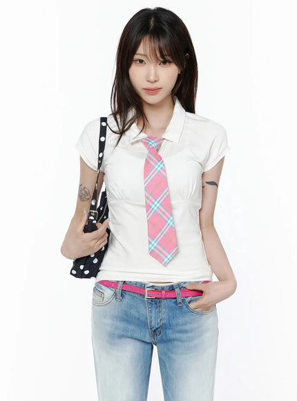 LEWKIN Pintuck Short Sleeve Collar Top IL502 White front view on model styled with pink plaid tie and polka dot bag over jeans size S/M
