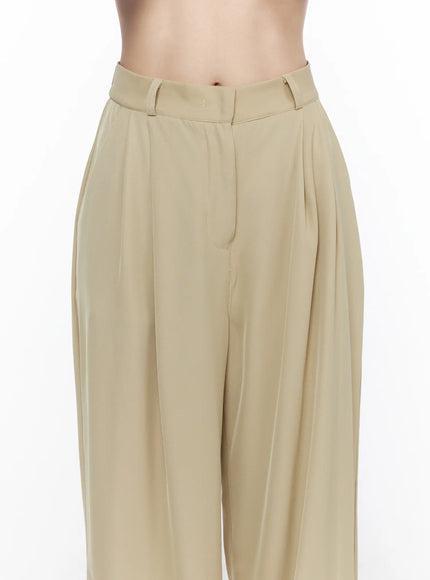 Pintuck Wide Leg Pants (Beige) CL524 Beige close-up detail shot on model showing high-rise waistband belt loops and deep pintuck pleats