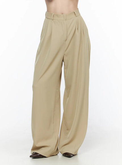 Pintuck Wide Leg Pants (Beige) CL524 Beige close-up front shot on model showing high-waist pintuck pleats and wide-leg silhouette