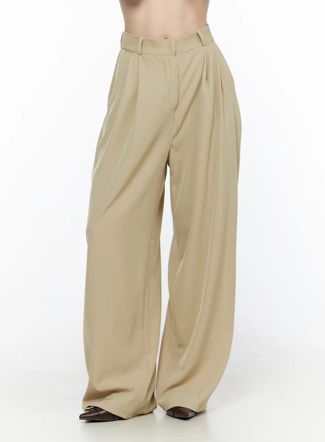 Pintuck Wide Leg Pants (Beige) CL524 Beige close-up front shot on model showing high-waist pintuck pleats and wide-leg silhouette