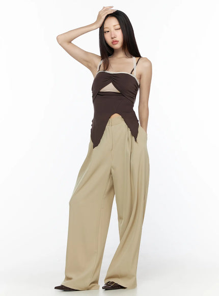 Pintuck Wide Leg Pants (Beige) CL524 Beige full-length front shot on model hand raised to forehead styled with dark brown cami top