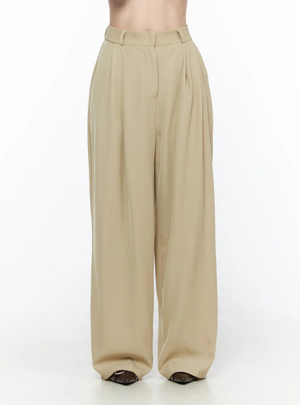 Pintuck Wide Leg Pants (Beige) CL524 Beige front shot on model showing full-length wide-leg trousers with pintuck pleats and structured waistband