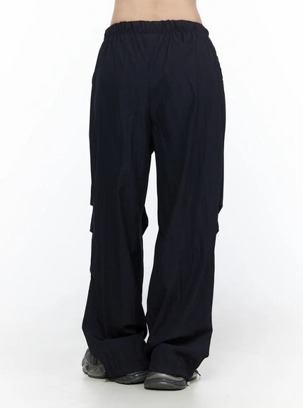 Pintuck Wide Leg Pants CL527 Dark blue back view on model showing elastic waistband, layered pintuck seam detail, and voluminous wide-leg silhouette