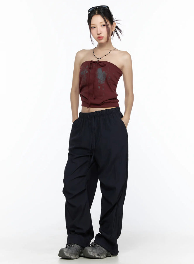 Pintuck Wide Leg Pants CL527 Dark blue full-length model shot front view styled with burgundy tube top, hands in pockets, oversized parachute fabric