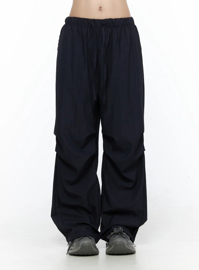 LEWKIN Pintuck Wide Leg Pants CL527 Dark blue front view on model wearing cropped tube top and sneakers, S/M, wide-leg silhouette with elastic drawstring waist