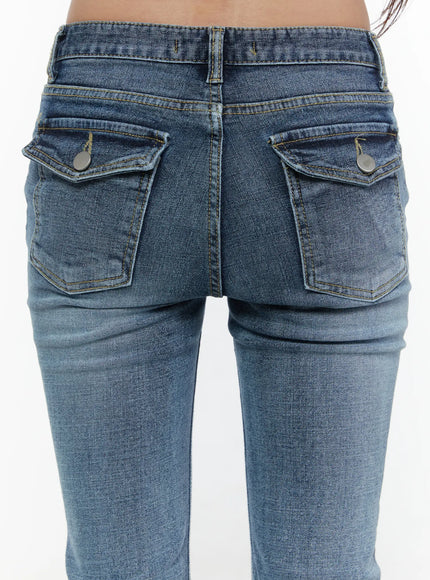 Pip Pocket Flare Jeans CL508 blue close-up back detail shot showing dual flap pockets with silver snap buttons and contrast golden stitching