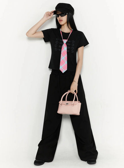 Plaid Adjustable Tie IL516 Pink full-body front shot on model wearing pink plaid tie over grey fitted tee with pink ruffle mini skirt white knee socks and silver heels