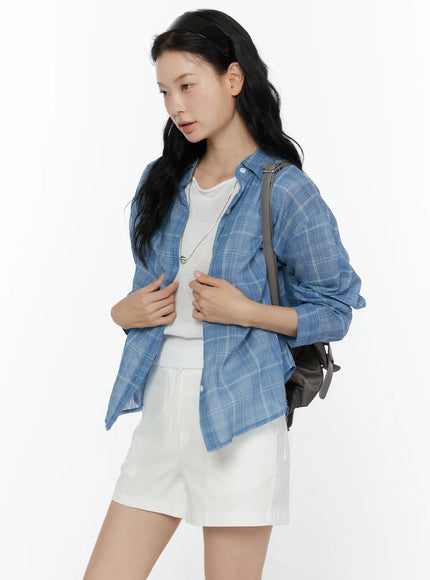 LEWKIN Plaid Button-Up Shirt CL521 Blue S/M angled shot on model wearing open over white tee and white shorts with gray backpack, lightweight plaid fabric