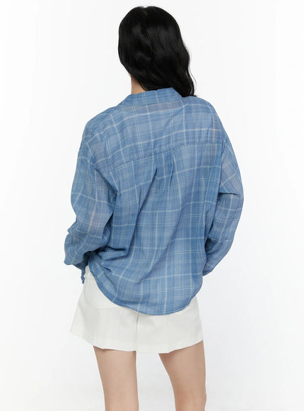 Plaid Button-Up Shirt CL521 Blue back shot on model showing relaxed oversized fit, plaid check pattern across back yoke and long sleeves, white shorts