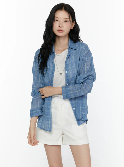 Plaid Button-Up Shirt CL521 Blue front shot on model standing upright, open over white knit tee and white shorts, semi-sheer plaid texture visible