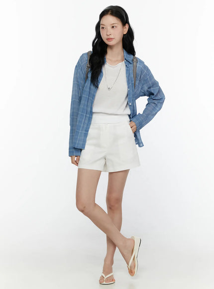 Plaid Button-Up Shirt CL521 Blue full-length front shot on model with hand on hip, open styling over white tee and shorts, gray backpack, flip-flops