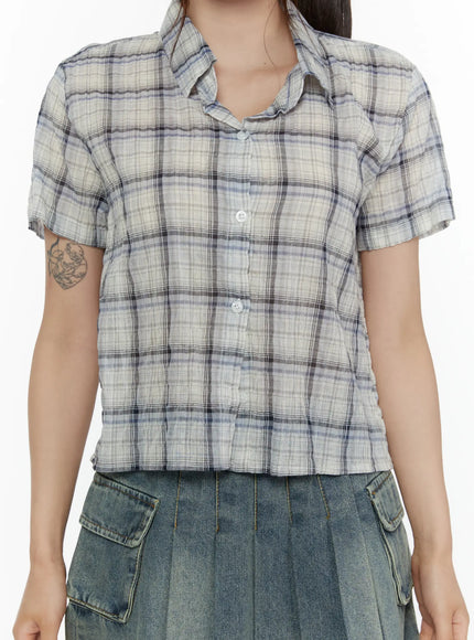 Plaid Crop Short Sleeve Shirt CL507 Light beige close-up crop shot on model showing button front collar and lightweight woven plaid fabric texture