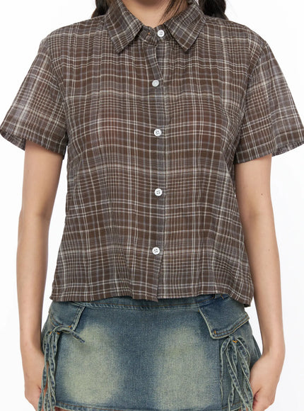 Plaid Crop Short Sleeve Shirt CL514 Brown close-up front detail shot on model showing point collar button placket chest pocket and crinkle plaid fabric texture
