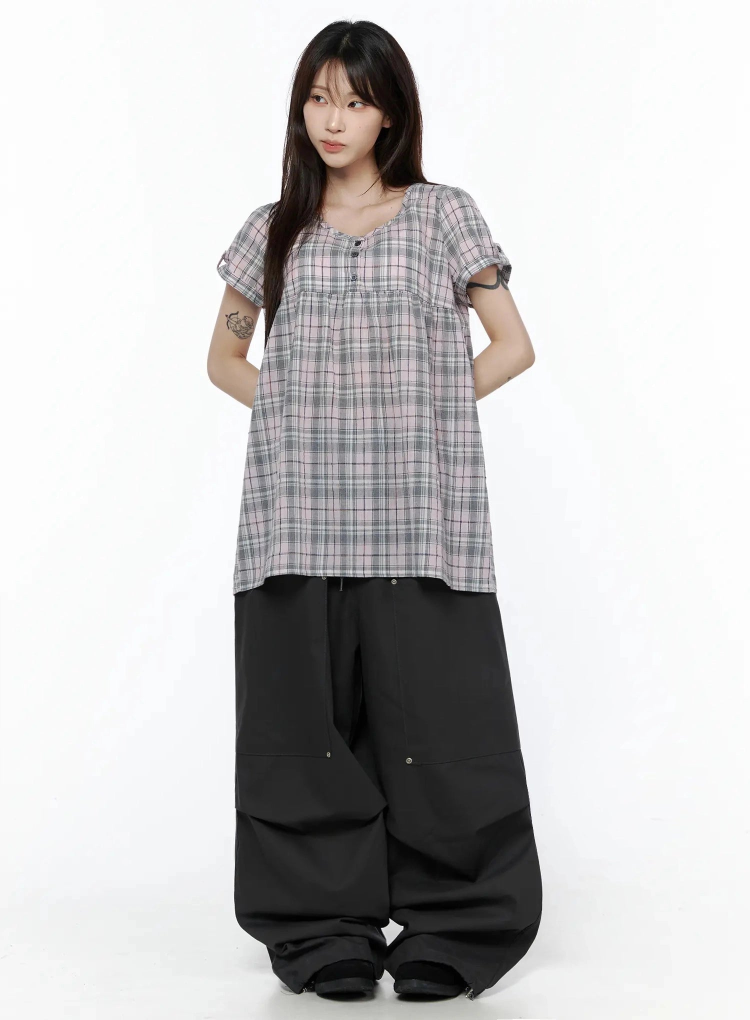 Plaid Cuffed Sleeve Babydoll Dress IL502 Pink full-body front shot on model with hands behind back, looking away, styled with black wide-leg cargo pants