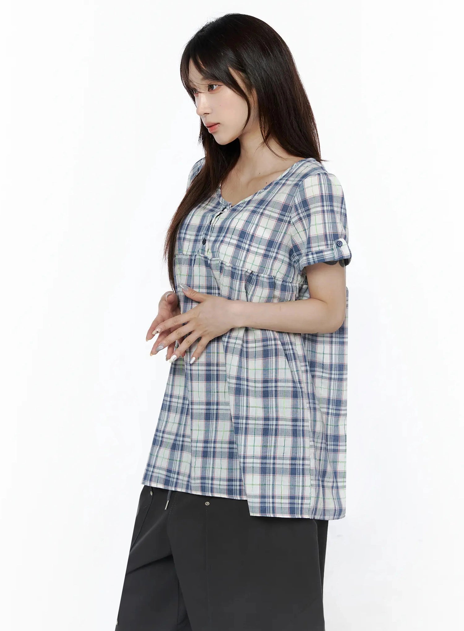 Plaid Cuffed Sleeve Babydoll Dress IL502 Blue side shot on model showing A-line silhouette, gathered empire waist, and cuffed short sleeves paired with black pants