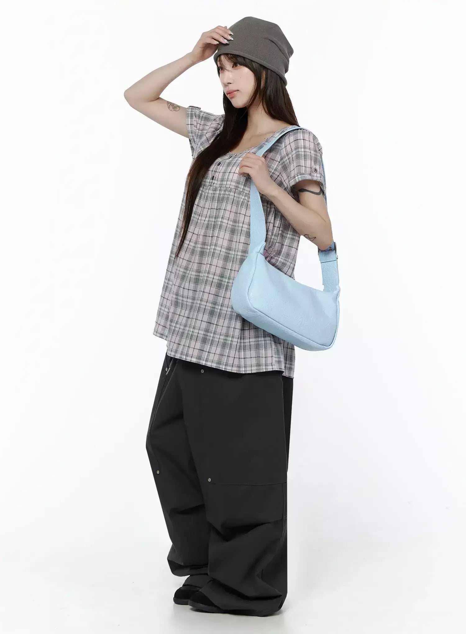 Plaid Cuffed Sleeve Babydoll Dress IL502 Pink side lifestyle shot on model wearing grey beanie and light blue shoulder bag, hand raised to hat, casual street styling