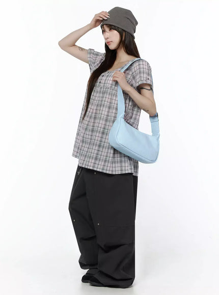 Plaid Cuffed Sleeve Babydoll Dress IL502 Pink side lifestyle shot on model wearing grey beanie and light blue shoulder bag, hand raised to hat, casual street styling