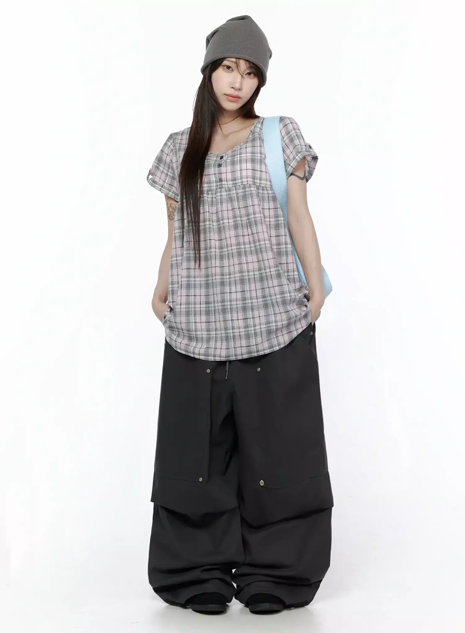 LEWKIN Plaid Cuffed Sleeve Babydoll Dress IL502 Pink full-body front shot on model styled with black wide-leg pants, grey beanie, and light blue shoulder bag