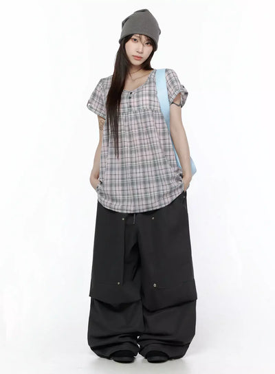 LEWKIN Plaid Cuffed Sleeve Babydoll Dress IL502 Pink full-body front shot on model styled with black wide-leg pants, grey beanie, and light blue shoulder bag