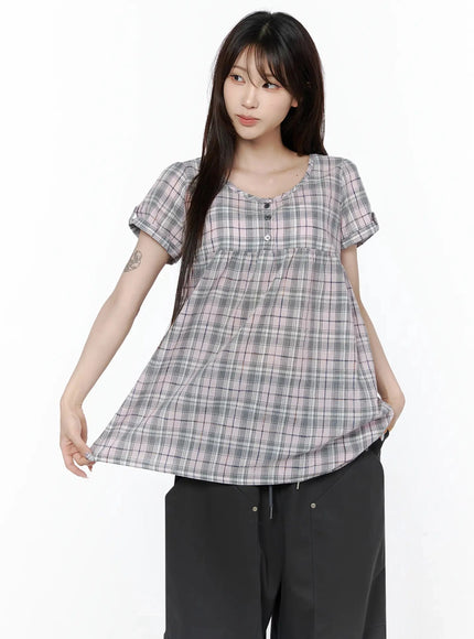 Plaid Cuffed Sleeve Babydoll Dress IL502 Pink front close-up on model highlighting scoop neckline, three-button placket, gathered babydoll cut, and cuffed sleeves