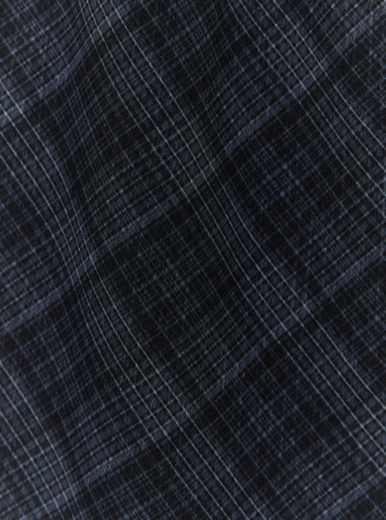 Plaid Layered Midi Skirt IL522 Black close-up fabric texture detail showing dark navy diagonal plaid woven pattern semi-sheer material