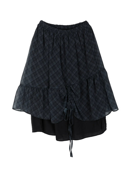 Plaid Layered Midi Skirt IL522 Black flat-lay overhead shot showing full skirt silhouette elastic waist ruched drawstring tie tiered ruffle hem sheer plaid outer layer over black underlayer