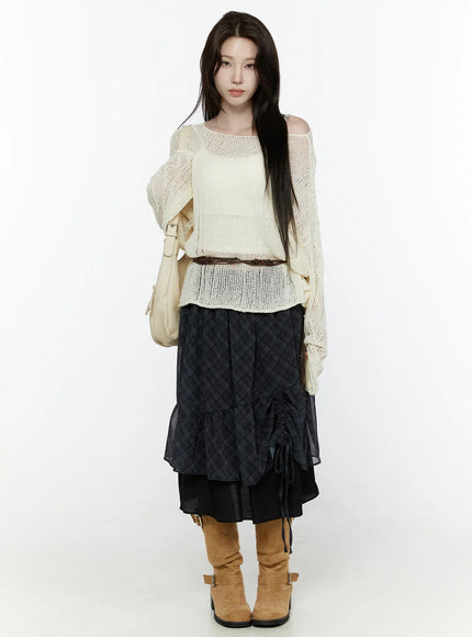 Plaid Layered Midi Skirt IL522 Black full-length front shot on model styled with cream open-knit sweater brown belt shoulder bag tan knee-high boots standing pose