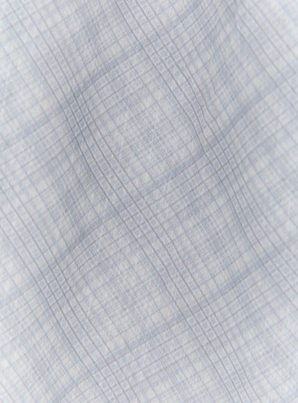 Plaid Layered Midi Skirt IL522 close-up fabric texture detail showing sheer light blue diagonal plaid woven pattern semi-transparent organza-like material