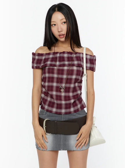 LEWKIN Plaid Off-Shoulder Shirt CU529 Red front model shot styled with gray denim mini skirt brown belt white shoulder bag and cross necklace