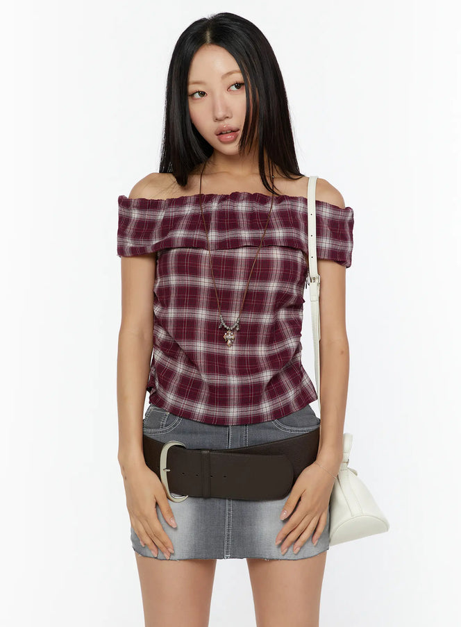 LEWKIN Plaid Off-Shoulder Shirt CU529 Red front model shot styled with gray denim mini skirt brown belt white shoulder bag and cross necklace