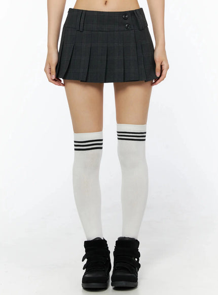 LEWKIN Plaid Pleated Mini Skirt IL516 Dark gray front shot on model size S styled with white knee-high striped socks and black sneakers