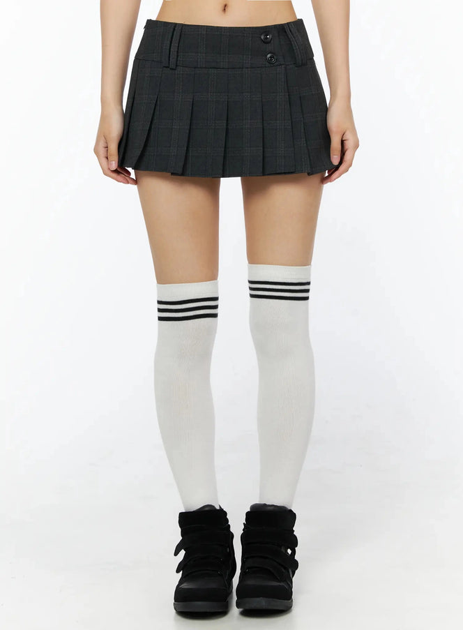 LEWKIN Plaid Pleated Mini Skirt IL516 Dark gray front shot on model size S styled with white knee-high striped socks and black sneakers