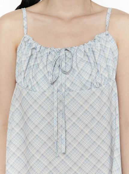 Plaid Shirred Cami Mini Dress IL506 Light blue close-up detail of ruched gathered neckline with front tie drawstring and diagonal plaid texture