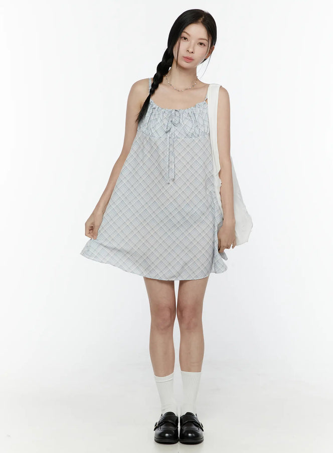 LEWKIN Plaid Shirred Cami Mini Dress IL506 Light blue front full-body model shot styled with white tote bag and black loafers size S/M